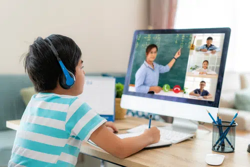 Student attending an online class from home
